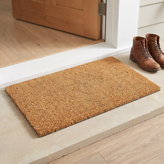 Ecomills natural coco coir doormat at front door threshold